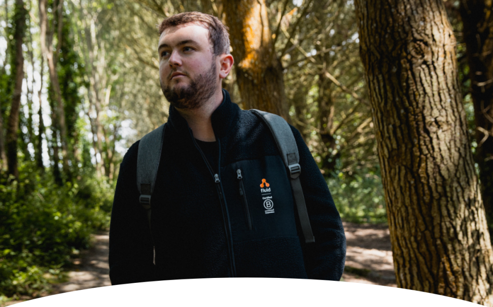 Man wearing Fluid Branding jacket outdoors