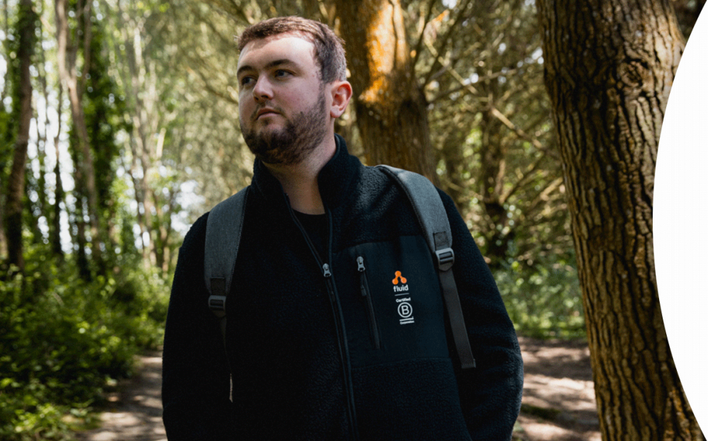 Man wearing Fluid Branding jacket outdoors