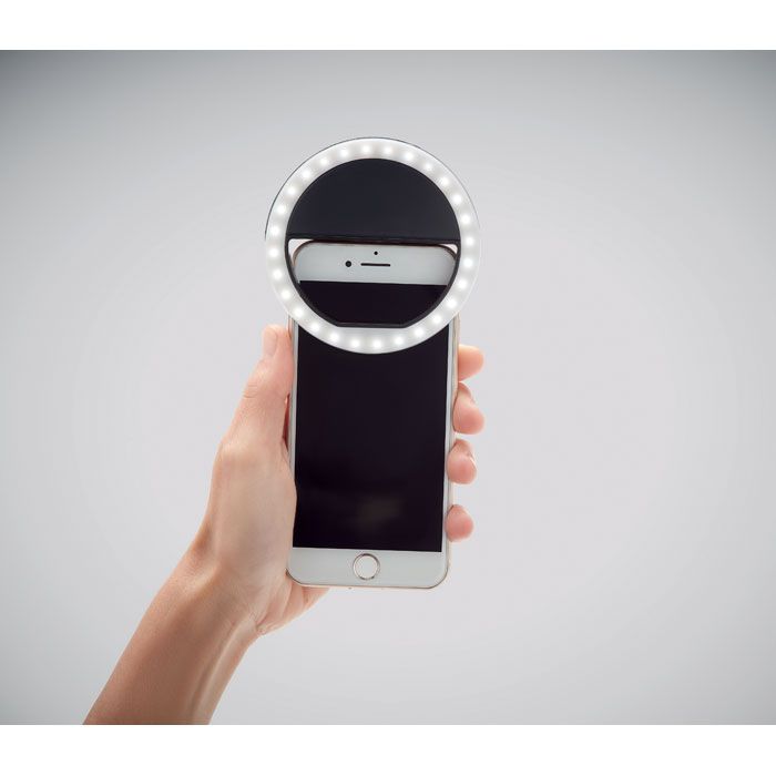 Helie Portable Selfie Ring Light on top of a mobile phone - switched on